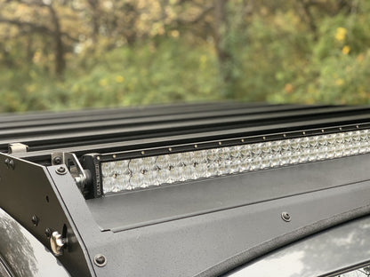 Close up view of gray Toyota Tacoma with Premium Roof Rack with exposed light bar- Cali Raised LED